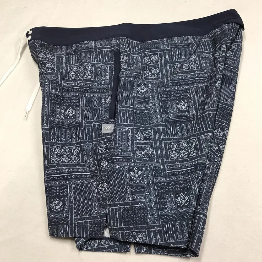 RHONE R&R Swim Trunks Men 38 Blue Floral Print Poly Stretch Mesh Lined